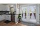 Kitchen featuring white cabinets, granite countertops, and access to the deck at 119 Tara Ter, Kings Mountain, NC 28086