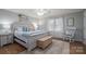Spacious main bedroom featuring a bed with decorative pillows and natural light at 119 Tara Ter, Kings Mountain, NC 28086