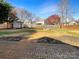 Large, fenced backyard with a patio, fire pit, and a storage shed at 1326 Dunmore Ct, Clover, SC 29710