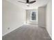 Bedroom with neutral carpeting, a ceiling fan, and a bright window at 1326 Dunmore Ct, Clover, SC 29710