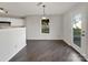 Cozy dining room with hardwood floors and a view of the backyard through a window at 1326 Dunmore Ct, Clover, SC 29710