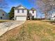 Charming two-story home with a well-manicured lawn and a driveway leading to an attached garage at 1326 Dunmore Ct, Clover, SC 29710