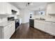 Well-lit kitchen featuring modern appliances, white cabinets, and a stainless steel dishwasher at 1326 Dunmore Ct, Clover, SC 29710