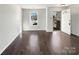 Inviting living room with hardwood floors, large window, and a neutral color scheme for versatile decor options at 1326 Dunmore Ct, Clover, SC 29710