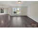 Large living room featuring hardwood floors, ample natural light, and plenty of space for comfortable living at 1326 Dunmore Ct, Clover, SC 29710