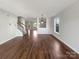 Spacious living room featuring hardwood floors and ample natural light from large windows at 1326 Dunmore Ct, Clover, SC 29710