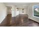 Bright living room with hardwood floors and an open floor plan adjacent to the kitchen at 1326 Dunmore Ct, Clover, SC 29710