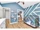 Stylish bedroom with blue accent wall and closet storage; suitable for a  at 13930 Thompson Rd, Mint Hill, NC 28227