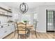 Cozy breakfast nook with natural light and modern chandelier at 13930 Thompson Rd, Mint Hill, NC 28227