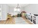Bright dining area featuring a view of the yard, modern light fixture, and toys at 13930 Thompson Rd, Mint Hill, NC 28227