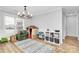 Bright dining area featuring a modern light fixture and ample space for Gathering activities and toy storage at 13930 Thompson Rd, Mint Hill, NC 28227