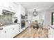 Stylish eat-in kitchen with modern appliances and hardwood floors at 13930 Thompson Rd, Mint Hill, NC 28227