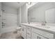 Bathroom featuring double vanity, quartz countertops, tiled floors, and a shower-tub combination at 1439 Hubert Graham Way, Tega Cay, SC 29708