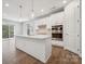 Modern kitchen with a large island, stainless steel appliances, and a bright, open layout at 1439 Hubert Graham Way, Tega Cay, SC 29708