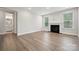 Comfortable living area featuring hardwood floors, a fireplace, and abundant natural light at 1439 Hubert Graham Way, Tega Cay, SC 29708