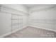Spacious walk-in closet with carpet and wire shelving for optimal storage and organization at 1439 Hubert Graham Way, Tega Cay, SC 29708