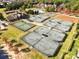 Aerial view of community amenities, including tennis courts, swimming pool, and clubhouse, offering diverse recreational opportunities at 15212 Caspian Way, Charlotte, NC 28278