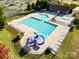 Community pool with slide, lounge chairs, and plenty of space for relaxation and recreation in a Gathering-friendly setting at 15212 Caspian Way, Charlotte, NC 28278