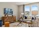 Comfortable living room with neutral furniture, television, and large windows with view at 15212 Caspian Way, Charlotte, NC 28278