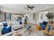 Open-concept living room flows seamlessly into the kitchen, featuring modern decor and hardwood floors at 15212 Caspian Way, Charlotte, NC 28278