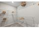 This well-organized walk-in closet has ample shelving and hanging space, perfect for streamlined storage at 15212 Caspian Way, Charlotte, NC 28278