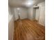 Bedroom with wood-look floors, natural light, and ample storage space at 1608 Van Dyke Dr, Charlotte, NC 28213