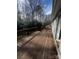 Wood deck surrounded by natural landscaping at 1608 Van Dyke Dr, Charlotte, NC 28213