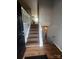 Inviting entryway with hardwood floors leads to staircase and rooms, creating a warm and welcoming atmosphere at 1608 Van Dyke Dr, Charlotte, NC 28213