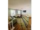 Cozy living room with a large rug, comfortable seating, and natural light, creating a relaxed atmosphere at 1608 Van Dyke Dr, Charlotte, NC 28213