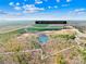 Aerial view of the 84.70 acre property showing the pond and wooded areas at 164 Linderman Lake Ln, Kings Mountain, NC 28086