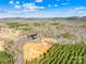 Aerial view of the property with a pond and the home surrounded by trees at 164 Linderman Lake Ln, Kings Mountain, NC 28086