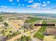 Panoramic aerial view showing the 84.70 acre property and the road, houses, and wooded areas at 164 Linderman Lake Ln, Kings Mountain, NC 28086