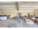 Large barn interior with tall ceilings and plenty of space for vehicles and equipment at 164 Linderman Lake Ln, Kings Mountain, NC 28086