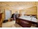 Cozy bedroom with wood paneled walls, large bed, and closet at 164 Linderman Lake Ln, Kings Mountain, NC 28086