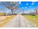 Stone entrance with beautiful blooming trees and landscaping at 164 Linderman Lake Ln, Kings Mountain, NC 28086