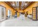 Large open-concept living space showcasing wood walls, dining area, and comfortable seating at 164 Linderman Lake Ln, Kings Mountain, NC 28086