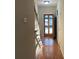 Hallway with stairs leading to the upper level of the home at 19915 Oak Leaf Cir, Cornelius, NC 28031