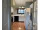 Well lit kitchen with white cabinets and black appliances at 19915 Oak Leaf Cir, Cornelius, NC 28031