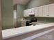 Cozy kitchen features white cabinets and modern appliances at 19915 Oak Leaf Cir, Cornelius, NC 28031