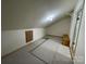 Unfinished room with angled ceiling, unfinished storage area with exposed beams and neutral walls at 19915 Oak Leaf Cir, Cornelius, NC 28031