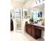 Well-appointed bathroom features a glass-enclosed shower, vanity with dark wood cabinets, and modern fixtures at 205 Edenshire Ct, Indian Trail, NC 28079