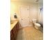 Functional bathroom features a toilet, vanity with cabinet space, and a shower with patterned curtain at 205 Edenshire Ct, Indian Trail, NC 28079