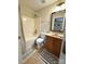 Cozy bathroom featuring a shower-tub combo, vanity with storage, and modern fixtures and neutral-tone decor at 205 Edenshire Ct, Indian Trail, NC 28079