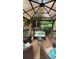 Outdoor gazebo featuring comfortable seating, a decorative rug, and scenic views of the surrounding landscape at 205 Edenshire Ct, Indian Trail, NC 28079
