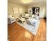 Comfortable living room boasts hardwood floors, modern decor and a stylish rug for a relaxing atmosphere at 205 Edenshire Ct, Indian Trail, NC 28079