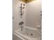 Bathroom featuring bathtub, shower head and wall mounted metal shelving at 215 Biscoe Rd, Troy, NC 27371