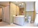 Bathroom with white cabinets, floral wallpaper and a shower curtain at 215 Biscoe Rd, Troy, NC 27371