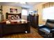 Bedroom with hardwood floors, a ceiling fan and a dark wood bedframe at 215 Biscoe Rd, Troy, NC 27371