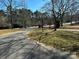 Long winding driveway through the trees to the home at 215 Biscoe Rd, Troy, NC 27371
