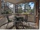 Covered porch showcasing outdoor dining set with a table and 4 chairs at 215 Biscoe Rd, Troy, NC 27371
